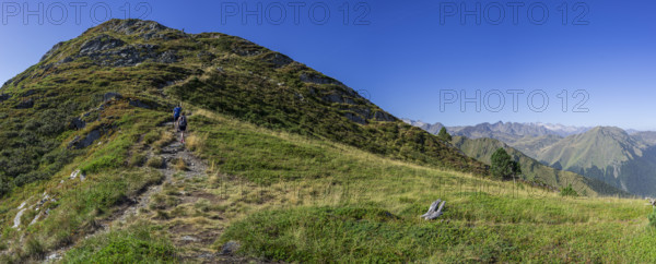 Couple ascending the path, Montcorbison, Aran Valley, Lérida province, Spain, Europe