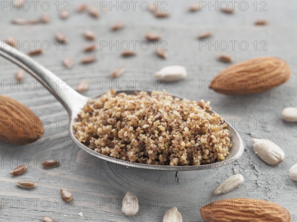 Homemade LSA mix in spoon - Linseed or flax seeds, Sunflower seeds and Almonds. Traditional Australian blend of ground, source of dietary fiber, protein, omega fatty acids. Copy space for text