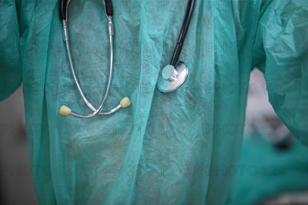 Close-up of a stethoscope over a green medical scrub