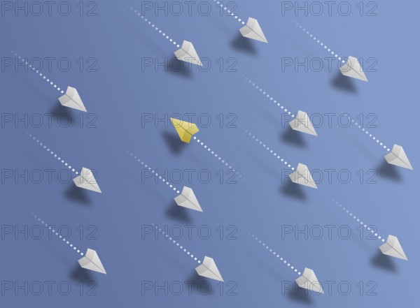 group of paper planes flying in one direction on blue background and one paper glider going in different or opposite direction, breaking new ground and stepping out of the line concept