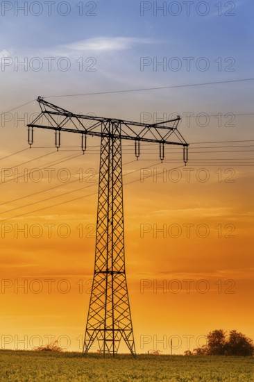 High-voltage power line High-voltage pylon in the sunset