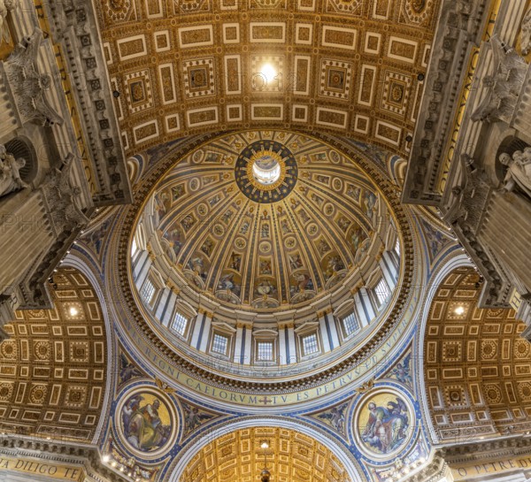 A picture of the huge dome of the St. Peter's Basilica and the surrounding frescoes and architecture as seen from the inside