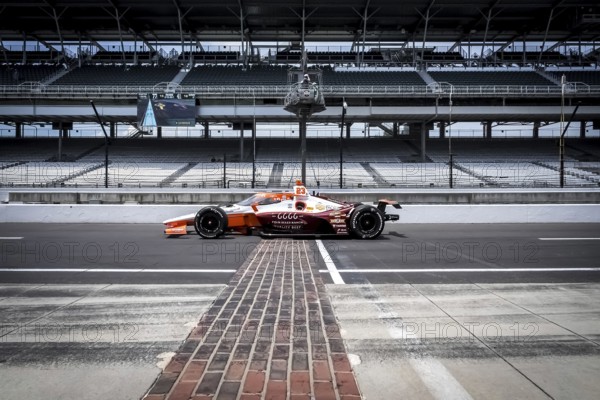 RYAN HUNTER-REAY (23) of Fort Lauderdale, Florida crosses the yard of bricks during a practice session for the Indy 500 at the Indianapolis Motor Speedway in Speedway, IN