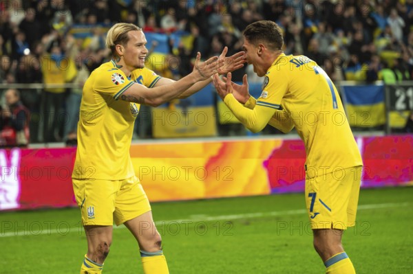 WROCLAW, POLAND - MARCH 26, 2024: Qualifications for UEFA Euro 2024. Final play-off match Ukraine - Iceland 2:1. Joy of Mykhailo Mudryk (L) and Georgiy Sudakov (R) after scoring goal.