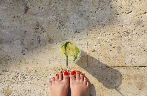 Lemonade glass on stone background