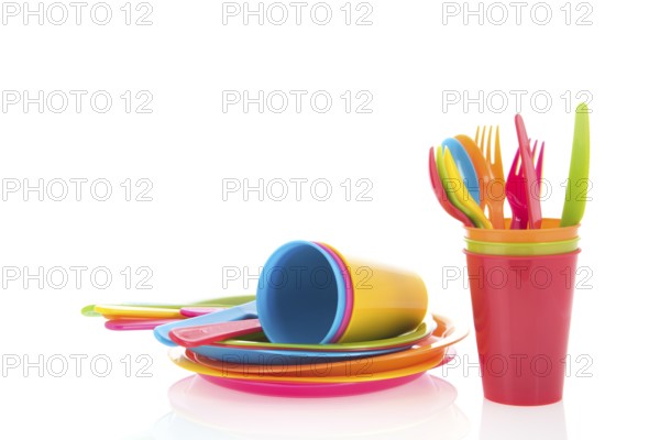 Picnic crockery and cutlery in all colors isolated over white background