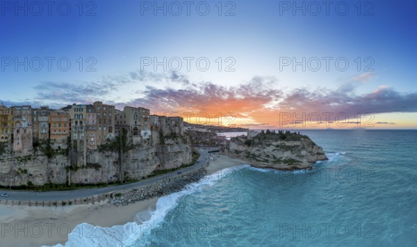 Tropea, Italy, 16 December, 2023: panorama view of Rotonda Beach and the colourful old town of Tropea in Calabria at sunset, Europe