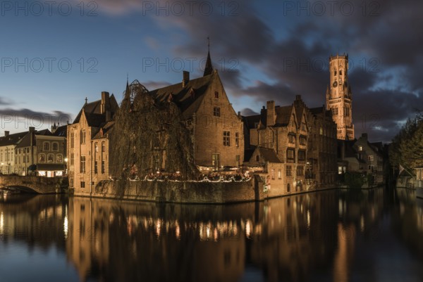 Bruges, West Flemish Region, Belgium, 11 15 2017: The historical Rozenhoedkaai reflecting in the canal, Europe