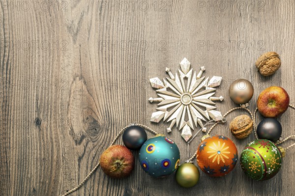 Christmas decoration glass balls on a wooden background