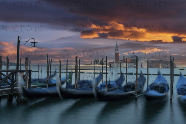 Moored Gondolas during High Tide at the St Marks Square in the early morning, Venice