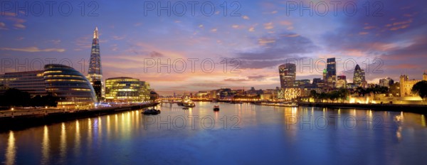 London skyline sunset with City Hall and financial on Thames river