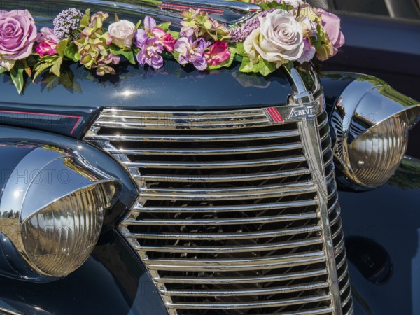 Vintage car with flower arrangement and chrome-plated radiator grille, Bocholt, Münsterland, Germany, Europe