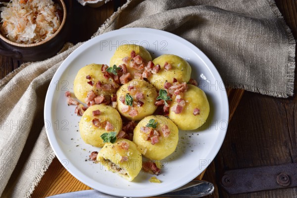 Polish dumplings with meat and mushroom sauerkraut filling