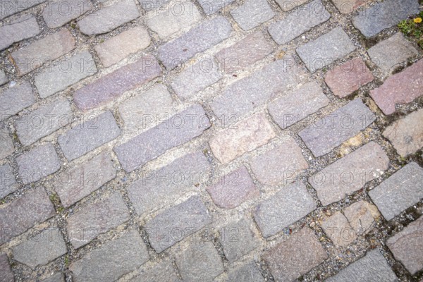 An image of a cobblestone street background texture