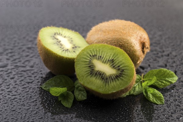 Juicy kiwi fruit and freas mint leaves