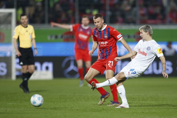 Football, Bundesliga 1, Matchday 26, 2024/2025, 1. FC Heidenheim vs. Holstein Kiel, 16/03/2025, Voith-Arena, Heidenheim, Germany, John TOLKIN (Holstein Kiel, 47) in duel with Adrian BECK (1. FC Heidenheim, 21), Europe