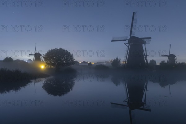 Foggy moonlit night at Kinderdijk, Netherlands