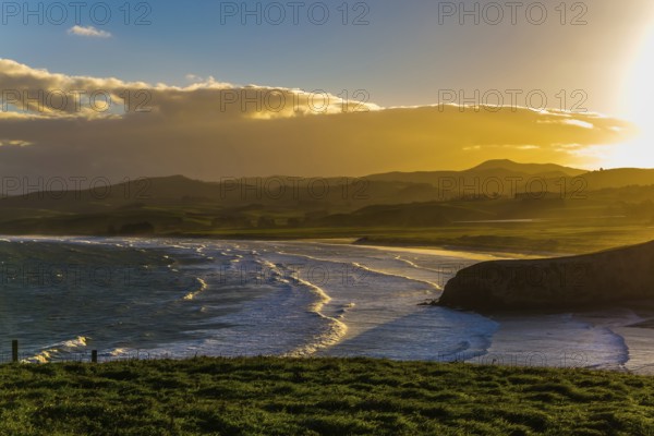 Picturesque Pacific coast of sunset. Concept of active and ecological tourism. Exotic journey to the South Island, New Zealand, Oceania