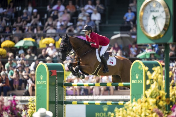 Tiffany Foster of Canada and riding Figor compete in the first round of the 1.60m CPKC International during the Spruce Meadows Masters, presented by Rolex, in Calgary, Alberta, Canada, North America