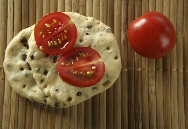 Sesame seeds biscuits over bamboo stripes