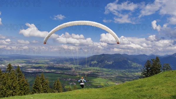 Paraglider takes off from the Blomberg launch site