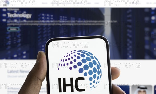 IHC logo is displayed on smartphone. International Holding Company (IHC) is a UAE based holding company