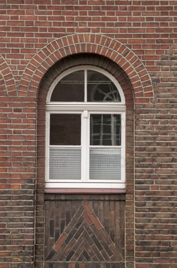 Large mullioned window on a 100-year-old building