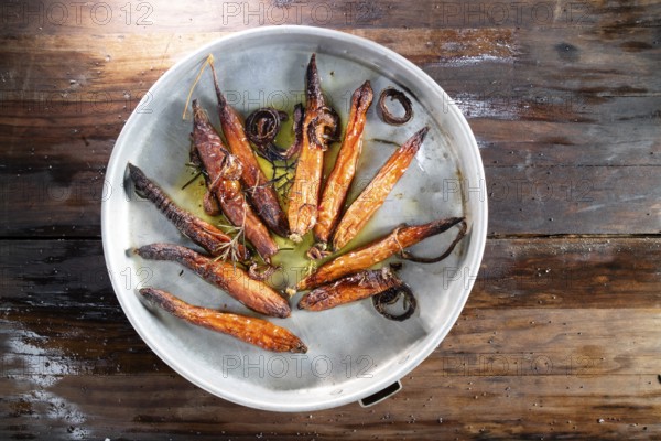 Photographic reproduction of a portion of carrots roasted in the oven