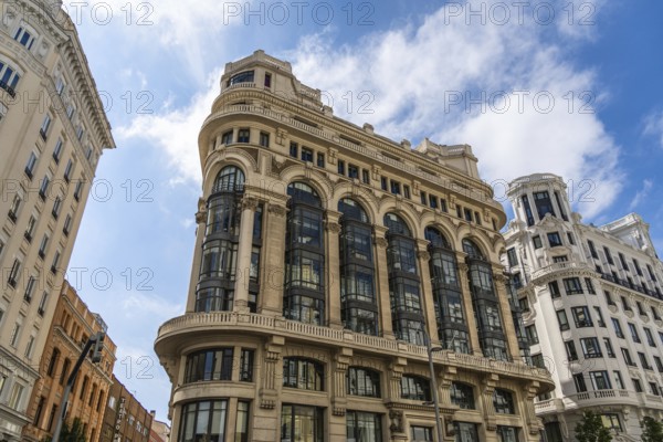 Madrid, Spain, October 10, 2021: Low angle view of the facade of the Matesanz building on Gran Via, designed by Antonio Palacios architect, Europe