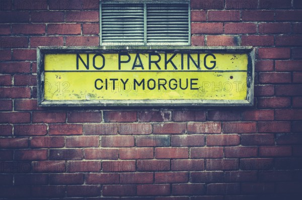 A No Parking Sign Outside A City Morgue In A US City