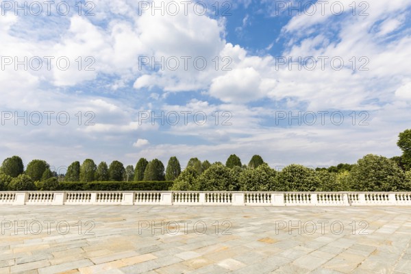Exterior with old grey floor made of stone. Vintage textured pavement and blue sky in the background
