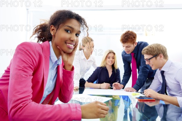Happy african businesswoman gesture in multi ethnic teamwork meeting at office