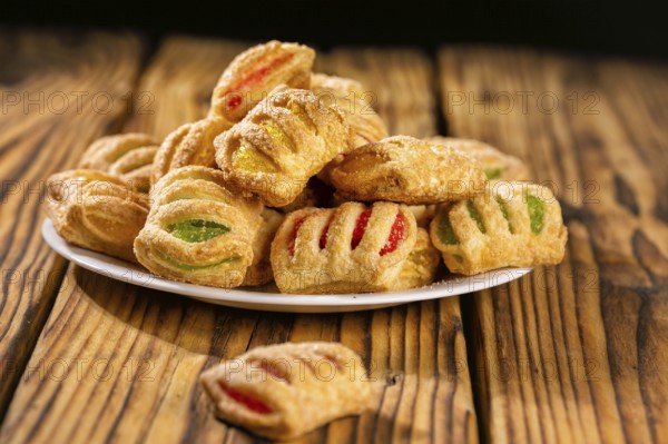 Cookies from puff pastry with coloured jam