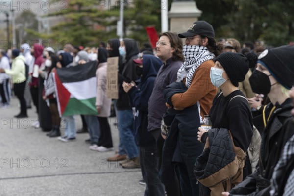 Toronto, Canada - 18 October 2023: The essence of unity is palpable in Toronto's streets, where thousands stand shoulder to shoulder in support of Palestinian justice.
