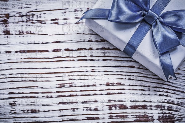 Packed present box on vintage wooden board holidays concept
