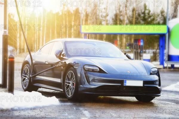 Porsche Taycan 4S electric car charging at Ionity. Paimio, Finland Jan 23, 21. Debuted in 2020, Porsche Taycan is the first all-electric car by Porsche