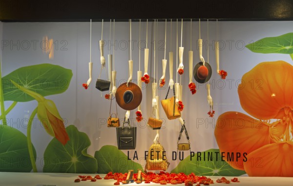 PARIS, FRANCE, MARCH 27, 2017: Fashion accessories in the showcase of the Printemps department store in Paris, France. Spring and summer theme