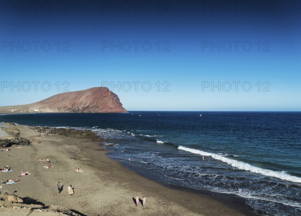 Las tejitas volcanic beach and montana roja landmark landscape in south tenerife spain