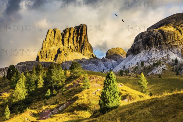 Last sunny day of fall. Concept of active and extreme tourism. Travel in the Dolomites. To pass Faltsarego approaching snowstorm