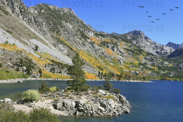 Fishing paradise. Azure lake in autumn mountains