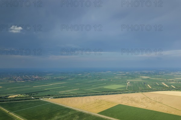 Aerial view of agricultural fields. Cloudy countryside, Aerial view