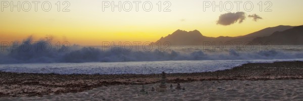 Surf wave at sunset on the beach in Porto, Corsica