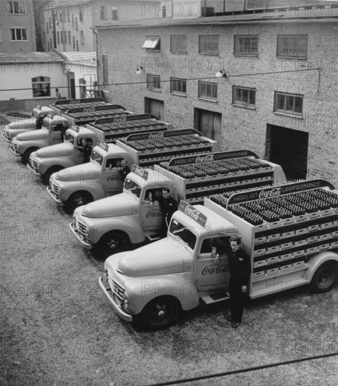 Coca cola in the 1950s. In 1 january 1953 Coca-Cola was first allowed to be manufactured and sold in Sweden, previously being restricted from sales in Sweden since the content of Coca-cola included forbidden substances like phosphoric acid and caffeine. Overview of the first distribution trucks of the brewery Mineralvattenfabriken Tre Kronor loaded with Coca-Cola bottles. Volvo trucks model L34 modifyed and painted in red for the exclusive use on Coca-Cola trucks. Coca-Cola was early with having advertising on their vehicles. Sweden 1953