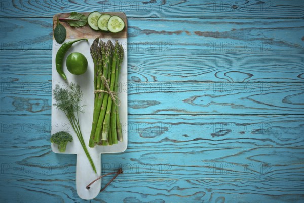 Healthy food vegetables for heart heath on wooden turquoise background