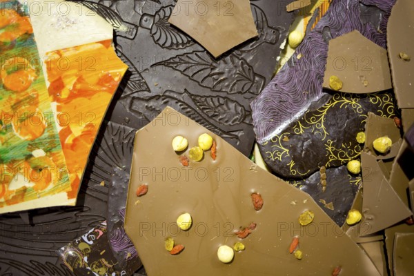 Handmade and painted chocolate. Brown milky and dark chocolade. Extremely tasty and delicious desserts. Sweets full with sugar. Unhealthy food diet