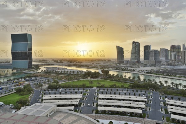 Aerial view of buildings and streets of Doha, Qatar during sunset. HDR image
