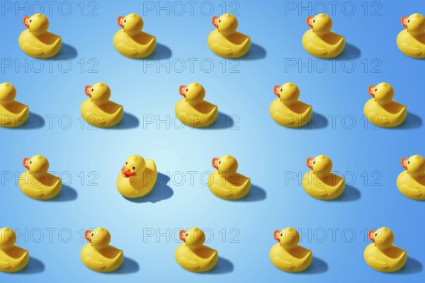 Fashion minimalistic concept of a yellow rubber duck pattern flat lay. Not like everyone else, goes against the system