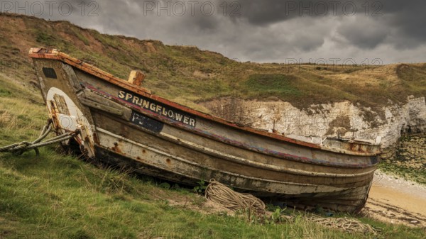 Flamborough, East Riding of Yorkshire, England, UK, September 14, 2018: An old fishing boat on the cliffs of Flamborough North Landing