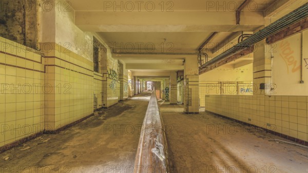 Long abandoned corridor with tiled walls and graffiti, industrial decay, Preventorium Dolhain, Lost Place, Limbourg, Province of Liège, Belgium, Europe