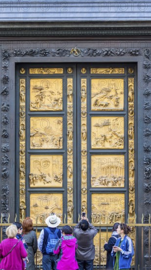 People at the Gates of Paradise at the Baptistery of St. John in Florence, Italy, Europe